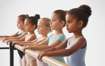 Image showing children in ballet attire practicing barre exercises in a ballet studio